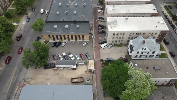 View over Minneapolis neighborhood with apartments and businesses. Public transportation stops.