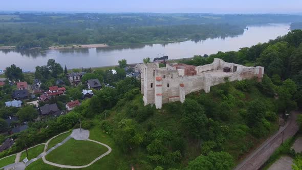 Zoom Shot of Historical Building Situated on Green Hill alt