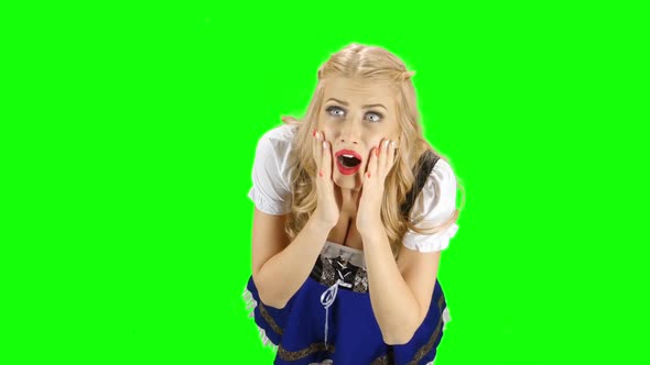 Bavarian Woman Something Really Admires the One in the Room. Green Screen alt