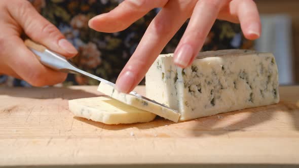 Closeup View Of Slicing Blue Cheese