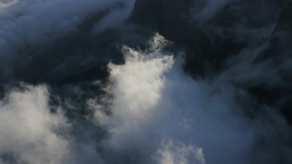 Aerial View Of Clouds Rolling In Evening Sunlight In Caldera de Taburiente National Park La Palma