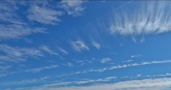 Amazing View of White Fluffy Clouds Moving Softly on Bright Blue Sky alt