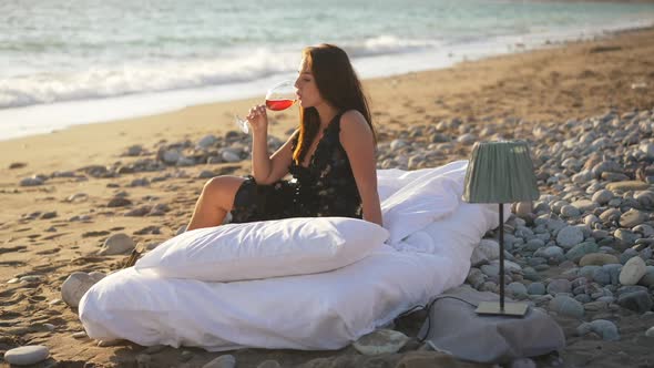 Side View Portrait of Smiling Relaxed Beautiful Young Woman Drinking Red Wine in Slow Motion in alt
