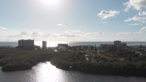A very slow drone flight toward the sun of Lido Key in Sarasota, Florida alt