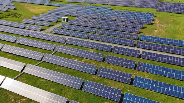 solar panels at a solar energy generation farm alt