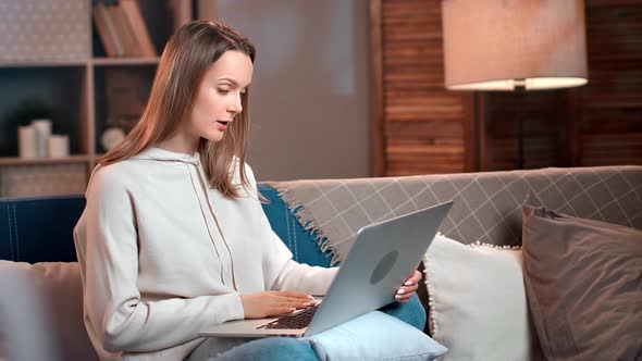 Happy Woman Talking Online Video Call to Friends Relatives Use Laptop at Comfortable Evening Home alt