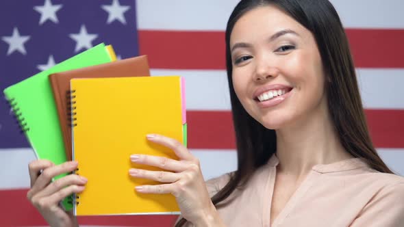 Happy Student Showing Notebooks American Flag Background, University Education alt