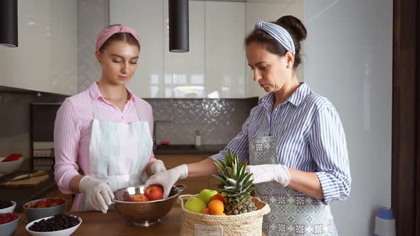 Women Using Fruits on Kitchen