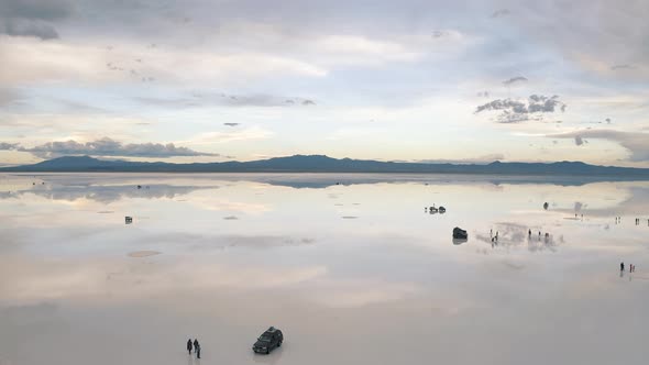 Drone footage of Salar De Uyuni reflection water salt lake, desert in Bolivia 4K
