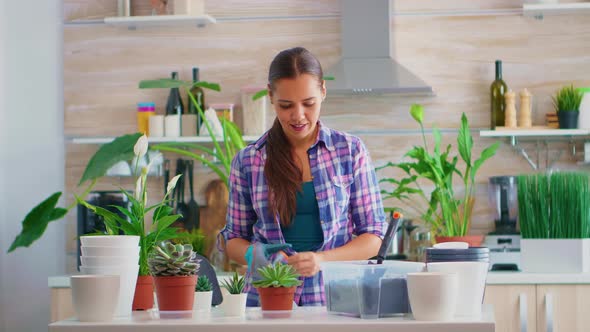 Woman House Gardening in Kitchen alt