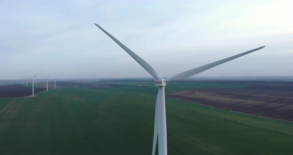 Clean Sustainable Energy Wind Farm Turbines 4K Aerial Renewable Power alt