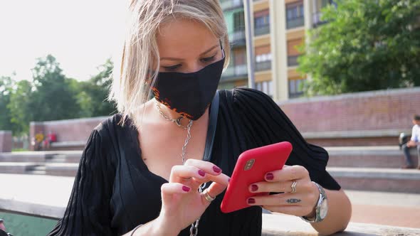 Woman wearing mask using smart phone