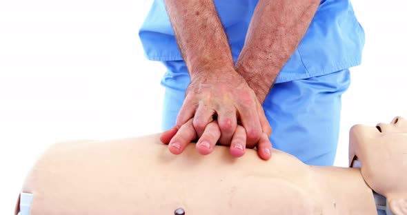 Male paramedic during cardiopulmonary resuscitation training alt