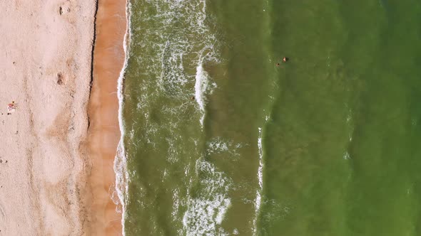 Aerial View of the Sandy Beach and Sea Waves
