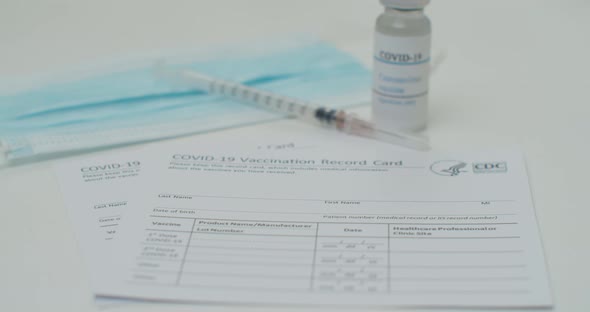 Medical Mask and COVID19 Vaccine on Vaccination Record Card Approved By CDC with Corona Virus alt