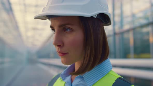 Portrait Woman Engineer Examining Production Factory Inspection Process Smiling alt