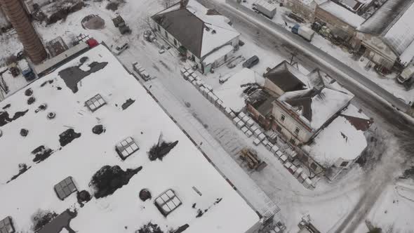 A Construction Tractor Rides On A Winter Road alt