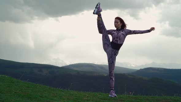 Athletic Woman Stretching Against Stunning Mountain Landscape alt