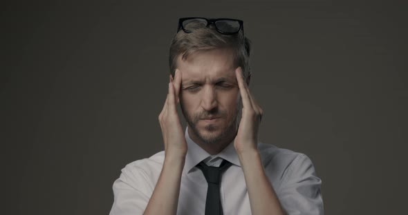 Stressed businessman with headache