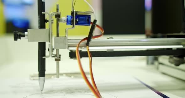 A Modern Robot Draws a Picture with a Ballpoint Pen Modern Technologies alt