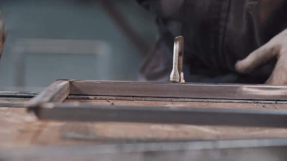 Working at the Manufacturing Plant  Drilling Holes in Metal Construction alt