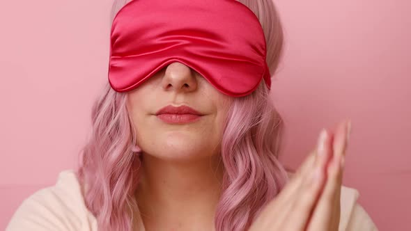 Young Sleepy Woman Wears Sleep Mask Making Sleep Gesture in Dorable Expression As Wants to Sleep