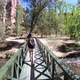 Female tourist walking on the bridge inIhlara valley in Cappadocia, Turkey - VideoHive Item for Sale