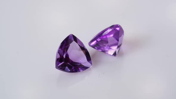 Natural Amethysts Spin on the White Background