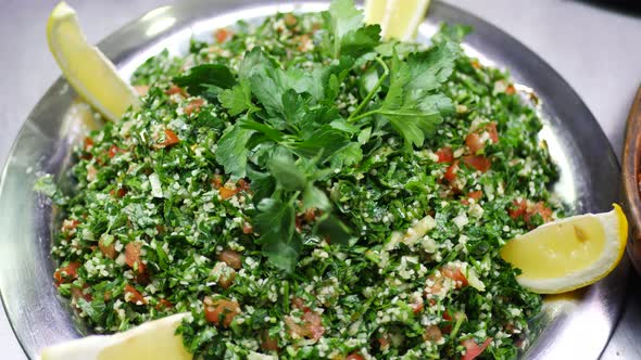 Millets Salad with Parsley Leaves, Green Dill, Slices of Tomato and Lemon alt