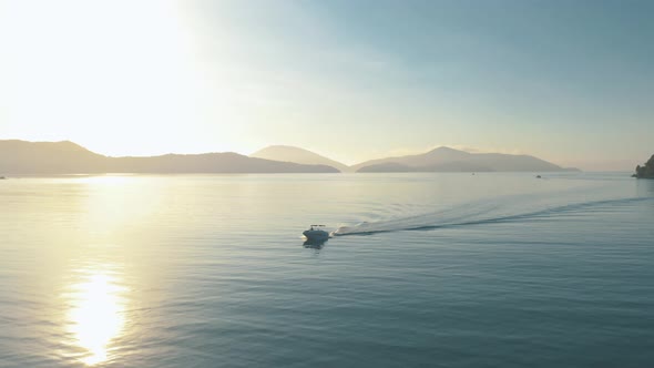 Drone video - Aerial - Speedboat sailing at sunrise