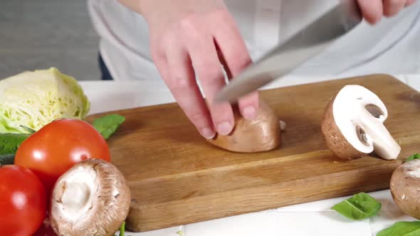 Close-up video of cutting mushrooms