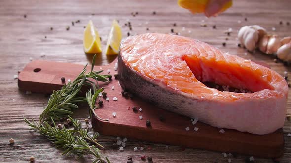 Raw, Fresh Salmon Steak on a Slate Board and Spices Around. Healthy Food Concept alt