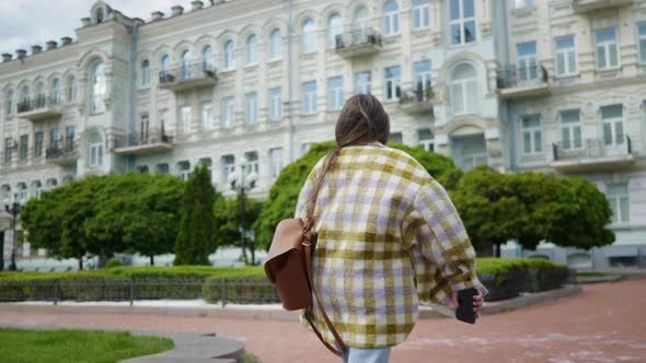 Girl Tourist Walking Around the City Posing for the Camera