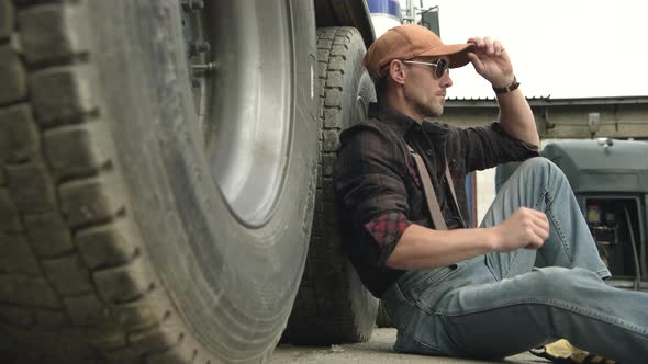 Commercial Truck Driver At Rest Stop.  alt