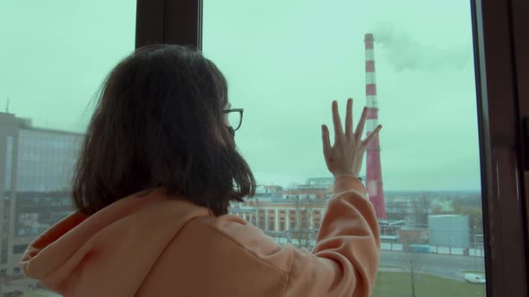 Sad Girl Looks at the Chimney with the Release of Chemical Waste Into the Sky Environmental Disaster