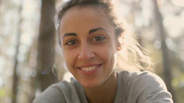 Close Up Happy Young Woman Laughs and Grimaces in Woods alt