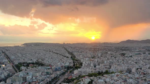 Aerial drone panoramic view of the Greek capital Athens at sunset with a sky