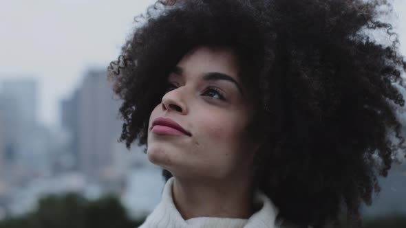 Portrait of Afro American Female on rooftop looking to camera, Manhattan - New York