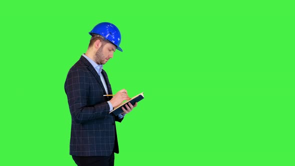 Architect Inspect Housing Estate Make Quality Control Visit to Building Male Engineer Making Notes alt