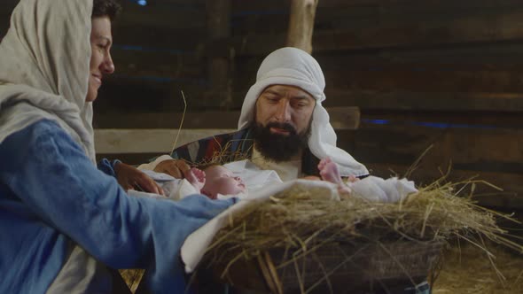 Mary and Joseph Admiring Baby Jesus alt