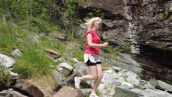 Woman in Great Waterfall of Bignasco alt