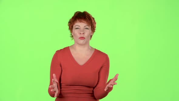 Woman Is Angry with Her Boyfriend, She Screams and Gestures Telling Him To Leave. Green Screen alt