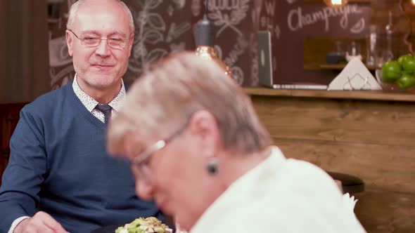 Old Man Gets a Present From His Wife on a Anniversary Date alt