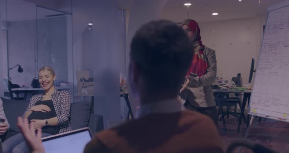 Businesswoman in Wheelchair Having Business Meeting with Team at Modern Office