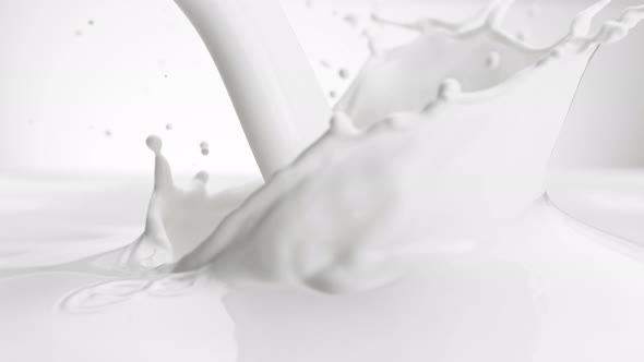 Super Slow Motion Shot of Pouring and Splashing Fresh Milk at 1000 Fps alt