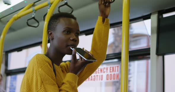 Woman talking on mobile phone while travelling in bus 4k alt