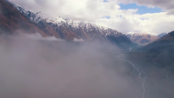 Magnificent Aerial View of Dariali Gorge From the Clouds Border Between Georgia and Russia alt