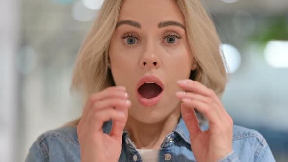 Close Up of Young Woman with Shocked Expression alt