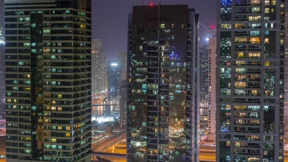 Residential and Office Buildings in Jumeirah Lake Towers District Night Timelapse in Dubai alt