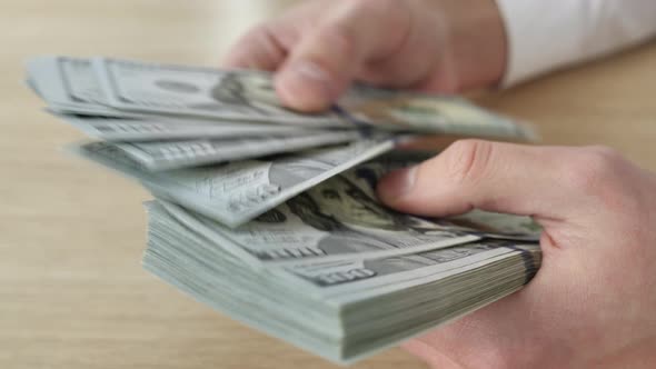 Close Up Man's Hands Counting Money American Dollars Bills alt